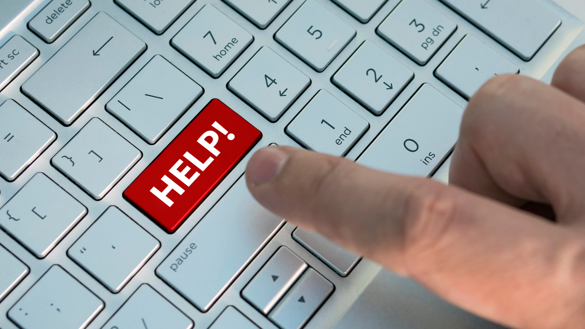 A picture of a computer keyboard with the word Help highlighted in red.